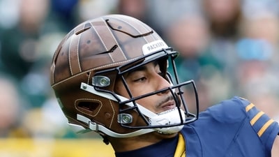 Flags of the United States and Ireland on the helmet worn by Green Bay Packers punter Daniel Whelan before playing the Carolina Panthers. (AP) Flags of the United States and Ireland on the helmet worn by Green Bay Packers punter Daniel Whelan before playing the Carolina Panthers. (AP)