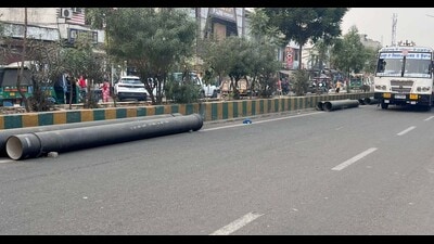 Sewerage pipes lying along Gill Road in Ludhiana on Sunday. (Manish/HT) Sewerage pipes lying along Gill Road in Ludhiana on Sunday. (Manish/HT)
