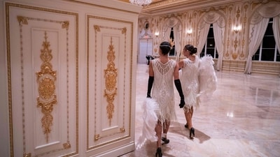 Dancers walk through an event hall at US President Donald Trump�s residence of Mar-a-Lago during a Halloween party in Palm Beach, Florida on October 31, 2025. (Photo by ROBERTO SCHMIDT / AFP) (AFP) Dancers walk through an event hall at US President Donald Trump�s residence of Mar-a-Lago during a Halloween party in Palm Beach, Florida on October 31, 2025. (Photo by ROBERTO SCHMIDT / AFP) (AFP)