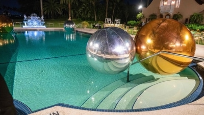 Giant balloons adorn a pool near where US President Donald Trump was hosting a Halloween party at his Mar-a-Lago residence in Palm Beach, Florida, on October 31, 2025. (Photo by ROBERTO SCHMIDT / AFP) (AFP) Giant balloons adorn a pool near where US President Donald Trump was hosting a Halloween party at his Mar-a-Lago residence in Palm Beach, Florida, on October 31, 2025. (Photo by ROBERTO SCHMIDT / AFP) (AFP)