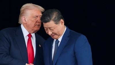 US President Donald Trump and Chinese President Xi Jinping talk as they leave after a bilateral meeting (REUTERS)