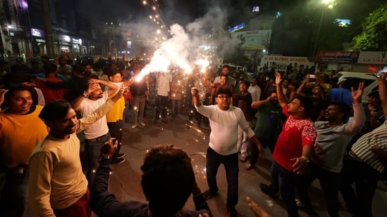 Fans in Lucknow celebrate India's win at the Hazratganj crossing after India's victory over South Africa in the final ICC Women's World Cup 2025(Deepak Gupta/Hindustan Times)
