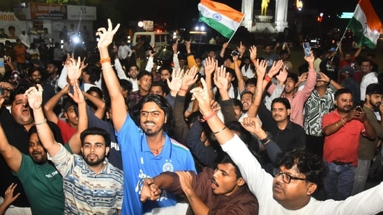 People celebrate at Lucknow's Hazratganj crossing after team India's win in world cup on Monday.(Deepak Gupta/Hindustan Times)
