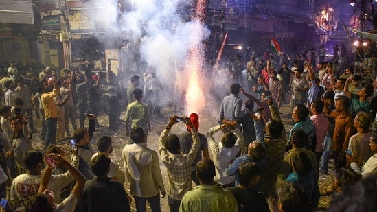 Prayagraj people burst crackers and celebrate after the Indian cricket team won the ICC Women's World Cup 2025(PTI)