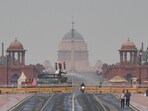 An anti-smog gun sprays fine water droplets to reduce the effects of air pollution, as a slight layer of smog is seen over Raisina Hills, in New Delhi on Monday. An anti-smog gun sprays fine water droplets to reduce the effects of air pollution, as a slight layer of smog is seen over Raisina Hills, in New Delhi on Monday.