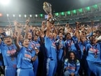 India's Harmanpreet Kaur celebrates with the trophy after winning the ICC Women's World Cup