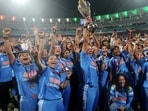 India's Harmanpreet Kaur and teammates celebrate with the trophy after winning the ICC Women's World Cup