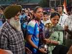 India's captain Harmanpreet Kaur, center, with her relatives after winning the ICC Women's World Cup 2025, at the DY Patil Stadium
