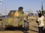 This image taken from a handout video released on Sudan's rebel paramilitary Rapid Support Forces (RSF) Telegram account shows RSF fighters celebrating in the streets of Al Fashir (or El-Fasher) in Sudan's Darfur. This image taken from a handout video released on Sudan's rebel paramilitary Rapid Support Forces (RSF) Telegram account shows RSF fighters celebrating in the streets of Al Fashir (or El-Fasher) in Sudan's Darfur.