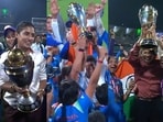 Mithali Raj, Anjum Chopra and Jhulan Goswami celebrate with the World Cup trophy during India's victory lap