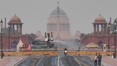 An anti-smog gun sprays fine water droplets to reduce the effects of air pollution, as a slight layer of smog is seen over Raisina Hills, in New Delhi on Monday. (ANI ) An anti-smog gun sprays fine water droplets to reduce the effects of air pollution, as a slight layer of smog is seen over Raisina Hills, in New Delhi on Monday. (ANI )
