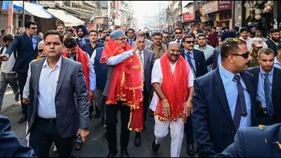 Jammu and Kashmir chief minister Omar Abdullah and his deputy Surinder Choudhary receiving a rousing welcome from people on their arrival for the biannual Darbar Move at Raghunath Bazaar in Jammu on Monday. (ANI Photo)