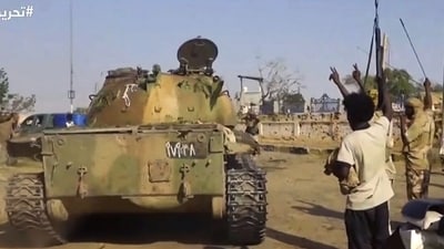 This image taken from a handout video released on Sudan's rebel paramilitary Rapid Support Forces (RSF) Telegram account shows RSF fighters celebrating in the streets of Al Fashir (or El-Fasher) in Sudan's Darfur. (AFP)