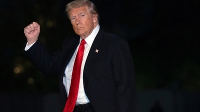 President Donald Trump gestures while walking across the South Lawn of the White House. (AP) President Donald Trump gestures while walking across the South Lawn of the White House. (AP)
