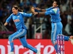 India's captain Harmanpreet Kaur (L) and allrounder Deepti Sharma celebrate the dismissal of South Africa skipper Laura Wolvaardt in the ICC Women's Cricket World Cup final in Navi Mumbai on Sunday. India won by 52 runs. (AP) India's captain Harmanpreet Kaur (L) and allrounder Deepti Sharma celebrate the dismissal of South Africa skipper Laura Wolvaardt in the ICC Women's Cricket World Cup final in Navi Mumbai on Sunday. India won by 52 runs. (AP)