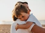 Parents are adjusting budgets after layoffs from Amazon, Target, and Nestlé. Experts suggest being honest with children about financial changes.(Unsplash)