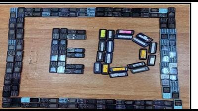 A sticker carrying a name and number was stuck on each phone, these were linked to mule accounts A sticker carrying a name and number was stuck on each phone, these were linked to mule accounts