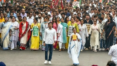 West Bengal CM Mamata Banerjee leads a rally, holding an edition of the Constitution of India, in protest against the SIR exercise, in Kolkata on Tuesday, November 4. TMC national gesecretary Abhishek Banerjee and other leaders were with her. (Debajyoti Chakraborty/ANI Photo)