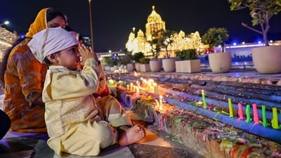 Gram it: Lighting candles at the Gurdwara Bangla Sahib is this child on the eve of gurpurab, which is the birth anniversary of Guru Nanak Dev. Devotees visited gurdwaras across Delhi-NCR to mark the celebrations on the auspicious occasion. (Photo: ANI)