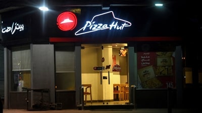Pizza Hut gets half of its sales from the US, where the company has around 6,500 stores; however, the US sales fell 7 per cent. (Reuters)