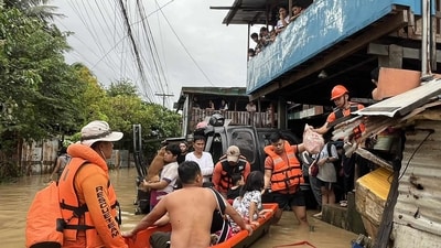 This handout photo taken and released on November 4, 2025 by the Philippine Coast Guard (PCG) shows coast guard personnel evacuating people from their flooded homes following heavy rains brought about by Typhoon Kalmaegi in Cebu province, central Philippines. (AFP) This handout photo taken and released on November 4, 2025 by the Philippine Coast Guard (PCG) shows coast guard personnel evacuating people from their flooded homes following heavy rains brought about by Typhoon Kalmaegi in Cebu province, central Philippines. (AFP)