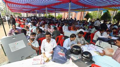 Polling officers check documents at distribution centre before they leave for Bihar assembly election duty, in Patna, on Tuesday. (ANI) Polling officers check documents at distribution centre before they leave for Bihar assembly election duty, in Patna, on Tuesday. (ANI)
