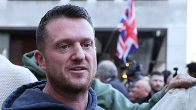 Anti-immigration activist Stephen Yaxley-Lennon, known as Tommy Robinson, acquitted of charges under the Terrorism Act for refusing to provide the PIN to his mobile phone, speaks outside Westminster Magistrates' Court in London, Britain, November 4, 2025. (Reuters)