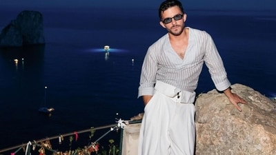 Jonathan celebrated the launch of Giorgio Armani's Mare collection in Capri, Italy, in a dashing loose, striped shirt and white, baggy dress-pants. (instagram/@jbayleaf)