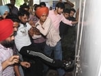 Students breaking open the gates of the admn block on Tuesday afternoon. (KESHAV SINGH/HT) Students breaking open the gates of the admn block on Tuesday afternoon. (KESHAV SINGH/HT)