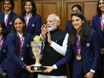 Indian team with the World Cup trophy and PM Narendra Modi Indian team with the World Cup trophy and PM Narendra Modi