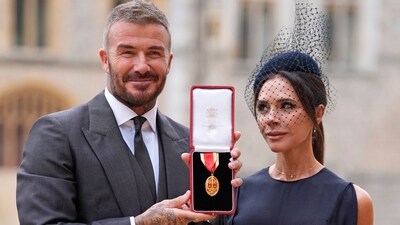 Sir David Beckham, with his wife Lady Victoria, after he was made a Knight Bachelor at an investiture ceremony at Windsor Castle. (AP) Sir David Beckham, with his wife Lady Victoria, after he was made a Knight Bachelor at an investiture ceremony at Windsor Castle. (AP)