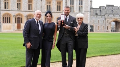 Dressed in a three-piece suit, which was designed by his wife Victoria Beckham, he was accompanied by her and with his parents. (AFP) Dressed in a three-piece suit, which was designed by his wife Victoria Beckham, he was accompanied by her and with his parents. (AFP)