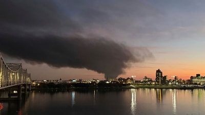 This photo provided by Chuck Fugate shows thick, black smoke rising after reports of a plane crash at Louisville International Airport. (AP)