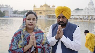 Punjab chief minister Bhagwant Mann with his wife Gurpreet Kaur at Golden Temple in Amritsar on the occasion of Gurpurb on Wednesday. (PTI Photo) Punjab chief minister Bhagwant Mann with his wife Gurpreet Kaur at Golden Temple in Amritsar on the occasion of Gurpurb on Wednesday. (PTI Photo)