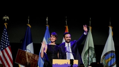 New York City mayor Zohran Mamdani and his wife Rama Duwaji wave to the crowd. (REUTERS)