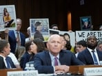 Photos of loved ones killed in Boeing 737 Max 8 plane crashes are held up as Boeing's CEO Dave Calhoun testifies before a Senate Homeland Security and Governmental Affairs Committee Investigations Subcommittee hearing on the safety culture at Boeing, on Capitol Hill in Washington, U.S., June 18, 2024. 