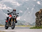 Ducati's Multistrada V4 Pikes Peak features a 1,158 cc V4 engine delivering 170 hp, optimized for agility and touring efficiency, with advanced electronics including Adaptive Cruise Control and a sophisticated suspension system.