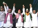 Samajwadi Party chief Akhilesh Yadav raises hands with INDIA bloc candidates during an election rally in support of the alliance’s candidates for the Bihar Assembly elections, in Bihar. (Handout via PTI Photo)