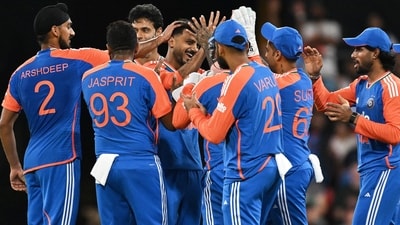 Indian bowler Axar Patel, centre, is congratulated by teammates after dismissing Australian batsman Matt Short (AP) Indian bowler Axar Patel, centre, is congratulated by teammates after dismissing Australian batsman Matt Short (AP)