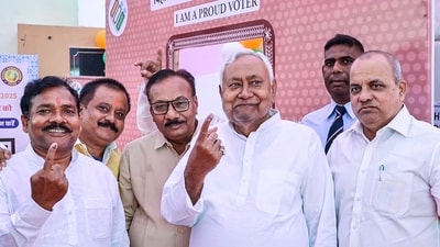 Bihar chief minister Nitish Kumar and others show their ink marked fingers after casting votes during the first phase of Bihar Assembly elections at Bakhtiyarpur in Patna district. (@NitishKumar) Bihar chief minister Nitish Kumar and others show their ink marked fingers after casting votes during the first phase of Bihar Assembly elections at Bakhtiyarpur in Patna district. (@NitishKumar)