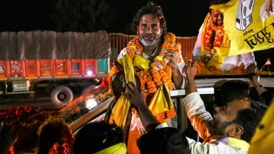 In this photograph taken on October 30, 2025, supporters of Prashant Kishor, founder of the Jan Suraaj party, welcome him with garlands during his roadshow at Darbhanga. (AFP) In this photograph taken on October 30, 2025, supporters of Prashant Kishor, founder of the Jan Suraaj party, welcome him with garlands during his roadshow at Darbhanga. (AFP)