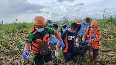 Rescuers carry a body bag containing the body of a victim of Typhoon Kalmaegi amongst sugar plantation at a village in Isabela town, Negros Oriental province, central Philippines. (AFP) Rescuers carry a body bag containing the body of a victim of Typhoon Kalmaegi amongst sugar plantation at a village in Isabela town, Negros Oriental province, central Philippines. (AFP)