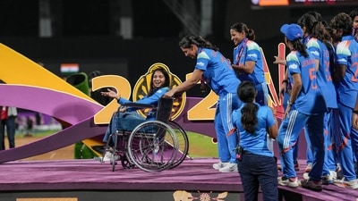 Smriti Mandhana brings teammate Pratika Rawal on a wheelchair as the team arrive to receive winning medals during the presentation ceremony after winning the Women's World Cup 2025 (PTI) Smriti Mandhana brings teammate Pratika Rawal on a wheelchair as the team arrive to receive winning medals during the presentation ceremony after winning the Women's World Cup 2025 (PTI)