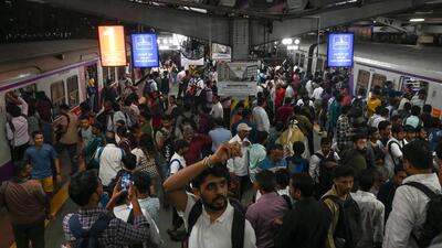 People jostled to get into trains as services were suspended. (Raju Shinde/HT Photo) People jostled to get into trains as services were suspended. (Raju Shinde/HT Photo)