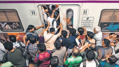 With services suspended, commuters jostled to get into trains that had left CSMT earlier. (Raju Shinde/HT Photo)