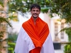 Ryan Williams poses with the Indian national flag.