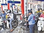 Motorcyclists wait in queues to get their vehicles filled with fuel, at a petrol pump in Navi Mumbai. (PTI file)
