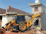 A house of a ‘drug smuggler’ being demolished in Kartar Nagar in Khanna on Thursday. (HT Photo) A house of a ‘drug smuggler’ being demolished in Kartar Nagar in Khanna on Thursday. (HT Photo)