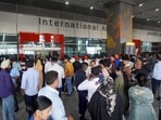 People wait outside the arrivals exit at the Indira Gandhi International (IGI) Airport, in New Delhi, in New Delhi, Friday, Nov. 7, 2025. People wait outside the arrivals exit at the Indira Gandhi International (IGI) Airport, in New Delhi, in New Delhi, Friday, Nov. 7, 2025.