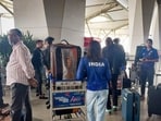 Passengers wait outside the departure terminal at IGI on Friday. (Sanjeev Verma/HT Photo)